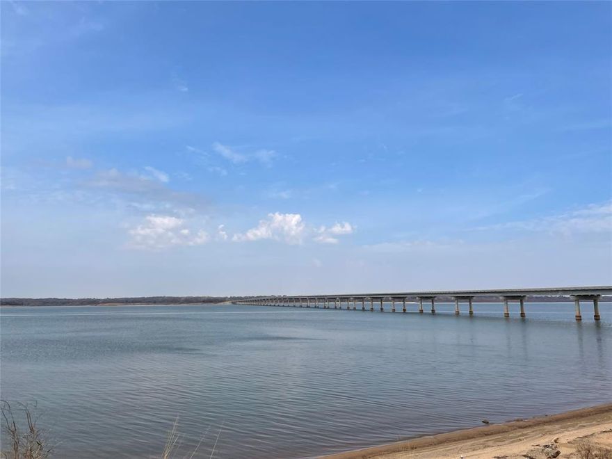 Discover your slice of Texas paradise on this exceptional 21-acre estate in the heart of Whitesboro, Grayson County - a rare blend of serene natural beauty, proven tax advantages, and prime build-ready potential. This ag-exempt gem (active agricultural exemption on 20 acres) delivers substantial annual property tax savings while providing an idyllic canvas for your dream private luxury homestead, legacy ranch, or recreational retreat. Wake to peaceful mornings along a picturesque, meandering creek that winds through the property, creating a park-like setting rich with wildlife and framed by mature trees and rolling terrain. Elevated building sites offer sweeping views, including glimpses of the neighbor's large pond, while the gentle topography ensures multiple ideal spots for your custom home or estate. An existing mobile home with RV hook-up, plus an additional outbuilding, adds immediate utility and convenience. Water lines run near the property line, making development straightforward. Best of all, you're just a quick 5-minute drive from the shores of Lake Texoma - perfect for boating, fishing, and weekend escapes - yet tucked away in peaceful countryside with easy access to Highway 377 and nearby growth corridors. Professional photos coming soon. The ultimate North Texas retreat awaits!