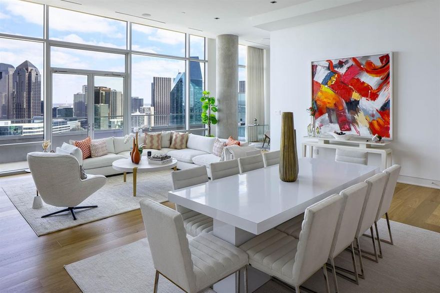 Perched high above the city at the iconic W Dallas – Victory, this custom-designed Penthouse offers a rare blend of modern glamour and effortless sophistication. Framed by dramatic downtown skyline views, the expansive private terrace becomes a true extension of the living space — perfect for sunset cocktails or intimate evenings overlooking the city lights.

Inside, soaring 13-foot ceilings and walls of glass create an airy, light-filled atmosphere. At the heart of the home, the open-concept chef’s kitchen pairs sleek design with exceptional functionality, showcasing elegant marble countertops and a full suite of premium Miele appliances. A built-in refrigerator, integrated wine cooler, gas cooktop, and dual ovens create a space equally suited for everyday living or elevated entertaining.

The thoughtfully imagined two-bedroom layout includes a separate office area, ideal for working in style. Designer finishes elevate every space, from the striking marble-surround fireplace anchoring the living room to the spa-inspired white marble baths. A massive custom closet delivers boutique-level storage, while every detail reflects elevated penthouse living.

Residents enjoy world-class Marriott hotel services including valet, concierge, onsite dining, spa services, state-of-the-art fitness center, and resort-style pool — delivering lock-and-leave convenience with uncompromising luxury.

A true statement residence in the sky.