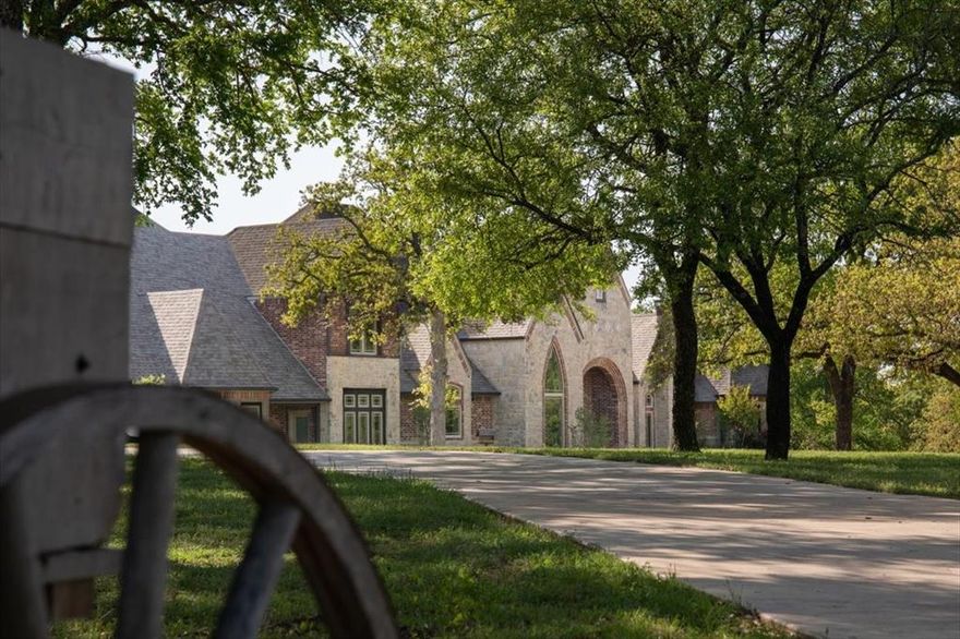 Welcome to one of the most extraordinary luxury estates on the market—where sophistication meets sustainability. This custom-designed home spans over 7,000 square feet and offers every amenity you could dream of, including energy independence through an elaborate solar panel system supported by Tesla backup batteries. Net zero energy bills and cutting-edge green technology make this property as practical as it is beautiful.

Step through the private gated entrance and up the concrete circle drive to find a masterfully crafted residence surrounded by mature hardwoods and drought-resistant landscaping. Inside, high-end finishes abound—brand new Pella windows, wood flooring, quartz countertops, new appliances, a smart camera security system, and even a safe room, all curated with a designer’s eye.

Entertain effortlessly in the expansive game room, media room, or outdoors in the oversized fenced pool area complete with a fully-equipped outdoor kitchen. A picturesque pond with a covered concrete sitting area and a treed backyard provide peaceful natural views, all centered around a stunning pool that seamlessly connects the main residence to the guest house.

Equestrians will appreciate the 14 horse stalls, multiple fenced pastures with loafing sheds, and a well-appointed foreman’s home. An oversized shop with an adjacent enclosed and insulated RV or horse trailer parking allow for even more versatility for guests, hobbies, or home-based business needs. And with lightning-fast fiber optic internet, you'll stay connected no matter your pursuits.

This one-of-a-kind estate is more than a home—it’s a private, self-sustaining retreat offering elegance, function, and freedom. Opportunities like this are rare. Don’t miss your chance to experience one of Hood County’s finest.