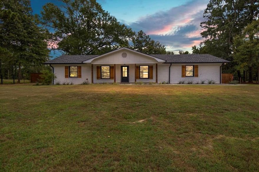 The location you've all been looking for! Located conveniently between Gilmer and Longview right off HWY 300 this move in ready fully updated 3 bed 2 bath home checks all the boxes! Finished out with higher end touches like wood look tile flooring, soft close cabinets and drawers, upgraded appliances, full tile primary shower and so much more! This home has an amazing front yard and a private backyard. There is even a gate at the entrance of the property for added security. Ready to get into this home before the holidays? The spacious living area would be ideal for entertaining so don't wait!