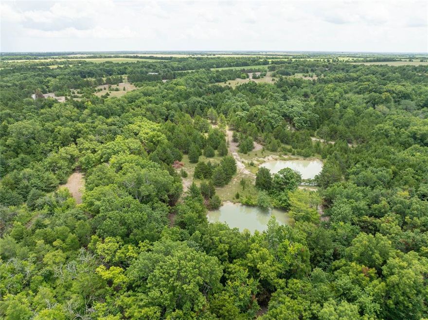 Tract #4 of 8 – Prime Country Living Near Bois d’Arc Lake – Build-Ready Lots Available! Owner Financing Available.  Discover your slice of Texas paradise just 8 miles from the shores of Bois d’Arc Lake and 10 miles from the newly constructed Lake Ralph Hall. Use your current home equity to purchase this land. See agent for more info.  Nestled south of Highway 82 with a Windom address, these serene parcels offer the perfect blend of nature, convenience, and opportunity. Property Highlights: - Peaceful Setting: Located at the end of a quiet, tree-lined county road with beautifully maintained surroundings - Natural Beauty: Each lot features mature native trees, walking trails, and scenic seasonal creeks; select tracts include private ponds -(Tract 4 has a pond) Ideal Topography: Flat, dry, and buildable land — ready for your dream home, cabin, or investment project - Easy Access: All parcels boast easy access on a newly built private road - Utilities Ready: Electricity is available on every lot - Water Access: water main by Bois D’Arc MUD is established - Water Update: Seller is actively funding the final line upgrade and extension to accommodate all new tracts. Whether you're seeking a peaceful retreat, a weekend getaway, or a smart land investment near Texas’s newest recreational lakes, these parcels check every box. Act now to secure your lot before prices rise with utility completion!.  Inquiries, call Listing Agent. Use for exact address:  725 County Road 2997 Windom, TX 75492