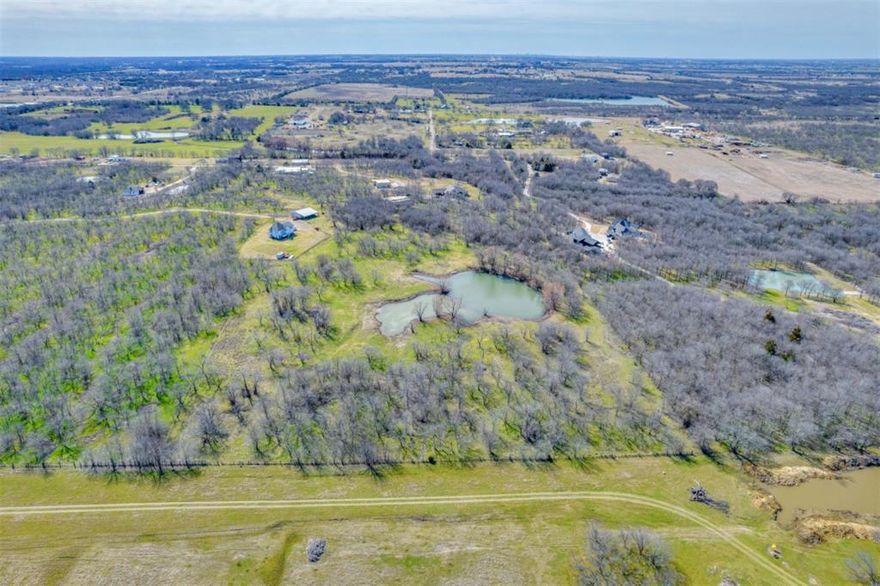 Amazing opportunity to own 11.88 acres with a nice pond in the growing town of Gunter. Very secluded & private. Currently ag exempt with no restrictions on this property. Additional 11 acres, with beautiful custom home, 5 stall barn, 30x50 shop with apartment and 40x30 shop with carport, also available for sale. Currently zoned outside of Gunter city limits, but close to Preston Rd and near DNT Extension. Utilities available. Listing includes approximately 11.88 acres of Grimes John A-G0455.