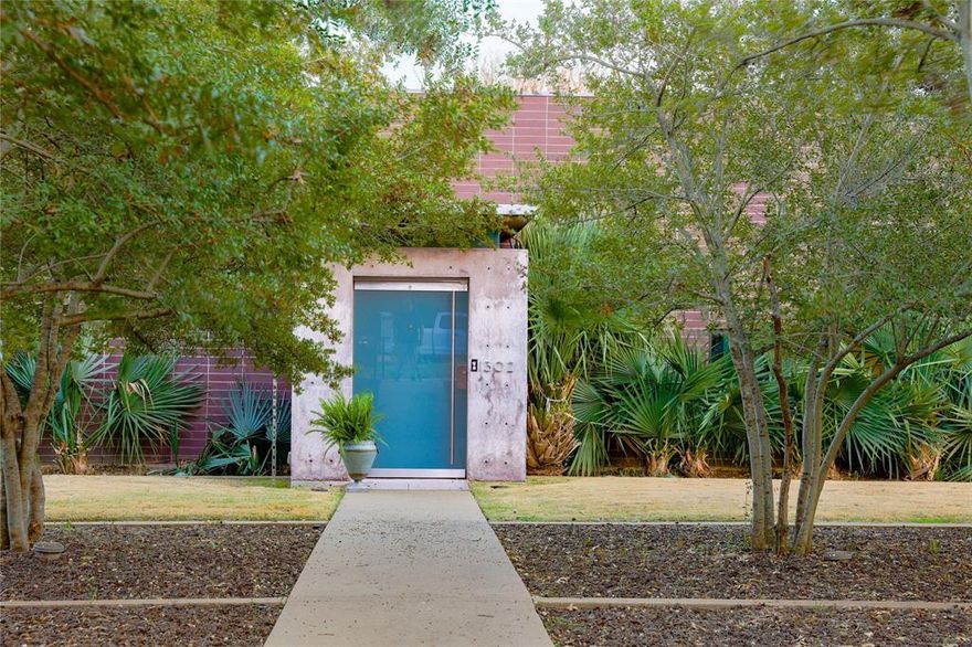 Spectacular AIA award winning home in E. Kessler on .5+ acre, estate-like lot.   Designed by leading modernist architect Russell Buchanan, with 4 bedrooms and 3.5 baths, the home offers hard to find, architecturally significant, one-level living.  Recent improvements include a stunning, resort-like infinity pool and deck.  The inspiration of the home, called “Open House” by the architect, was “to create a compound of buildings with barrier-free access to all areas, without harming the natural topography of the site.”  Floors are primarily concrete with a terrazzo style finish and ceilings   in the main living areas are 12 feet and 10 feet in most of the other spaces.  All living areas open to a covered patio through glass doors with magnetic stops.  The primary bedroom opens to patios in two directions Primary bath features double vanities, Calacatta marble counters and backsplash and tub surround, Ann Sacks glass tiles and Dornbract fittings.  Bulthoup kitchen has Gaggenau double ovens and 5-burner cooktop, Thermador refrigerator, Liebherr refrigerator-freezer and Caesarstone quarts countertops The second living area has floor-to-ceiling stained oak  bookcase and the fourth bedroom-studio is at the opposite end of the house from the “private wing.”  The utility room, adjacent to the primary suite, has a dog shower & drip area.  The original landscaping,  by Jeff Bargas, was designed to be drought tolerant and emphasizes indigenous plant material.  A very special and engaging home, in move-in condition. If you love superb modern design and a great neighborhoods, 1302 Eastus checks all the boxes.