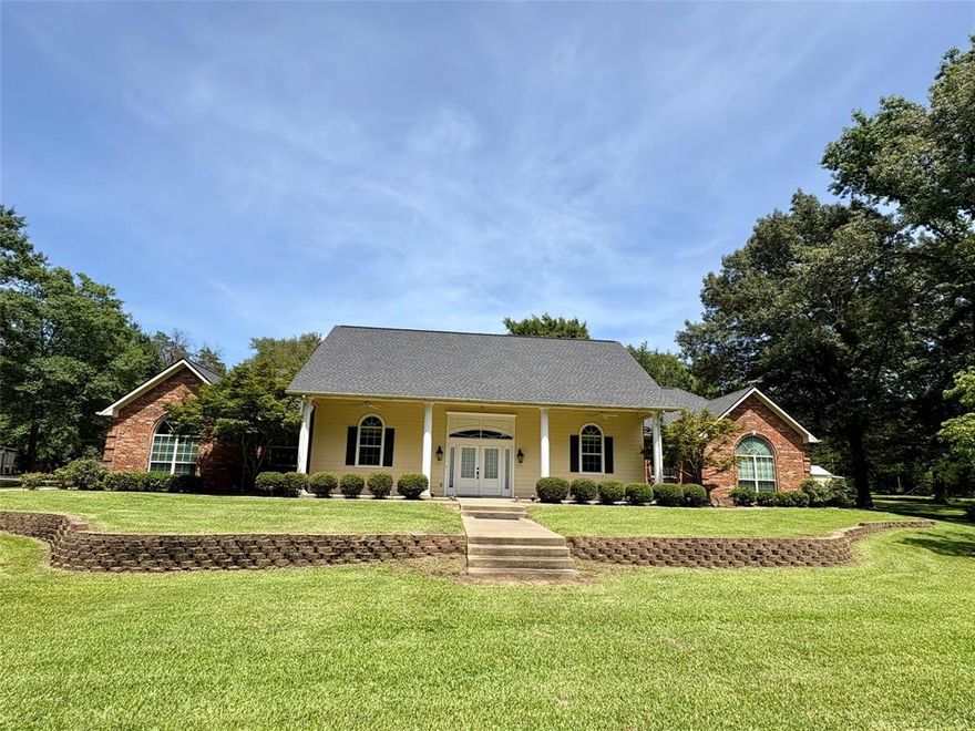 Close to everything, yet it feels like your own private getaway! This beautiful 4-bedroom, 3-bath home is perfectly nestled on the back portion of 4.64± acres, offering both privacy and convenience. Located directly across from Canton’s Mill Creek Lake, a stunning 237-acre lake (behind Walmart), you'll enjoy peaceful views, gorgeous sunsets, and  visits from local wildlife that roam through the tree-covered property.
This brick home features a spacious layout designed for comfort and versatility. The primary bedroom is generously sized and includes a impressive sized attached office with built in desk and cabinets—ideal for working from or just playing on the computer.  The cozy living area features a wood-burning fireplace, perfect for relaxing evenings, and the kitchen includes granite counter tops, and an island that makes meal prep and entertaining easy.
Need more space? This home also includes a second suite with its own separate entrance, full bathroom, and kitchenette—ideal for guests, extended family, or even for that mother-in-law. Outside, a long concrete circle driveway leads you past your very own private pond with a pier—perfect for simply enjoying a quiet moment.
Additional features include a large 2-car garage, an attached 1-car garage, and a spacious metal barn-workshop with a concrete floor with water and electricity—ideal for hobbies, storage, or a home-based business. With its rare combination of peaceful seclusion, practical features, and close proximity to town amenities, this property is a must-see for anyone looking for a little extra space without sacrificing convenience.