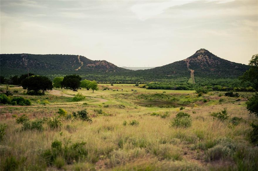 The best of the West Texas Hill Country! The recreational attributes of the CKS Ranch are truly unmatched with over 400 feet of elevation change on the property, exclusively including the historic East Peak with an elevation marker proving it as one of the highest peaks in the region. There are improved roads providing easy access up and down over 3.5 miles of private mountainsides. 

Water: There are two working water wells, several ponds, one of which is reportedly 25 feet deep and stocked with fish, one is spring fed maintaining water levels throughout the year, and one covering over 5 acres when full. The house has a water meter with Blair Water Supply Corp.

Hunting: The hills of the CKS Ranch are teeming with whitetail deer, Rio Grande Turkey, Bob White quail, and wild hogs. The secluded nature, water, and native brush of this ranch make the perfect habitat for these native species. The abundant surface water of the ranch also make for excellent dove and duck hunting.

Fishing: The pond nearest the house is reportedly stocked full of catfish, perch, and bass.

Ag Improvements: Low fence perimeter fencing and interior fenced into 5 separate pastures to facilitate rotational grazing, cattle guards provide easy access from pasture to pasture, approximately 100 acres were seeded with a mixture of improved grasses and wildflowers with excellent stands, and centrally located livestock pens.

Structural Improvements: The Headquarters includes a 2,791 SF, 4 bedroom residence, with an attached garage, 9 ft inground swimming pool, hot tub, and pavilion with a commercial kitchen and restroom. The yard surrounding the residence is landscaped and has a sprinkler system which runs off one of the wells. There is a 1,080 SF metal barn as well as an 800 SF livestock barn attached to the pens.

Many Equipment items present can be purchased separately.

Minerals: All owned minerals will convey; owner reported half owned but buyer to verify.