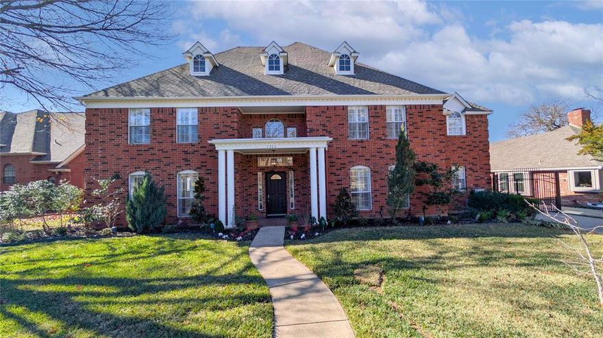 Executive-style home tucked away on a quiet cul-de-sac in a desirable Arlington neighborhood, zoned to highly sought-after Mansfield ISD. This beautifully updated residence offers timeless curb appeal and a light-filled interior with soaring ceilings in the foyer, living room, and dining room that create a grand and welcoming sense of arrival. The main living areas feature new first-floor flooring with rich hand-scraped wood in the living room, dining room, office, and primary bedroom. Architectural details include exposed wood ceiling beams in the kitchen and dining area, plantation shutters, and thoughtfully selected designer lighting throughout, highlighted by oversized chandeliers and recessed lighting that enhance the home’s scale and elegance. The kitchen is both refined and functional, featuring quartz countertops, a generous island, custom cabinetry, and a bright breakfast area framed by bay windows overlooking the backyard. A wet bar off the living room adds a sophisticated touch, ideal for entertaining or a dedicated coffee station. A conveniently located powder room and a private office with built-in cabinetry provide everyday comfort and flexibility for working from home. The primary suite serves as a serene retreat with a charming reading nook and a completely renovated spa-inspired bath featuring quartz countertops, custom cabinetry, a waterfall soaking tub, and a beautifully designed glass-enclosed shower with designer finishes. All bedrooms include walk-in closets, plantation shutters, and bladeless ceiling fans for modern comfort. Outdoor living is designed for year-round enjoyment with a pergola-covered kitchen, built-in grill, refrigerator, shelving, brick pavers, and a fire pit—creating a true extension of the living space. A gated driveway leads to a two-car garage with additional rear parking. Mature landscaping, including a stunning magnolia tree, and professionally installed landscape uplighting complete this exceptional home.