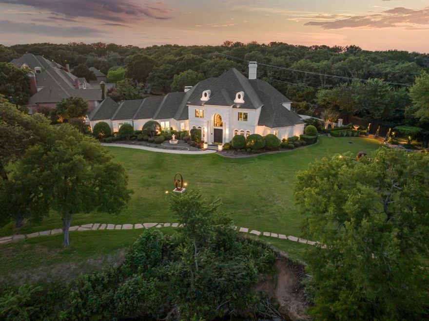 Experience a home that transcends luxury—5100 Oak Ln is a fully renovated, custom masterpiece that blurs the line between fine art and refined living. Set on 1.17 acres with tranquil pond views, walking gardens, and curated yard sculptures, this one-of-a-kind estate is an immersive living gallery. Inside, you'll find 5,908 sqft of inspired living space with 5 bedrooms, 4 full baths, and 1 half bath.

The home’s main level showcases custom wood floors, an elegant dining room, and a refined study off the main foyer—each enhanced by dramatic, custom lighting that extends throughout the home to highlight both structure and atmosphere. The beautifully updated kitchen features high-end finishes, custom cabinetry, and seamless flow into the surrounding living spaces—perfect for everyday living and elegant entertaining.

The primary suite offers a peaceful retreat with a spa-like ensuite bath and dual his and hers closets. Outdoor living is equally extraordinary with a resort-style pool, covered entertaining areas, and a second-floor patio overlooking the natural surroundings.

Bespoke cabinetry, lighting, surfaces, and flooring combined with your own private speakeasy, theater room, and art studio bring depth and personality to the interiors.

Bold, expressive, and unlike anything else—5100 Oak Ln is more than a home. It’s art, reimagined as a lifestyle.