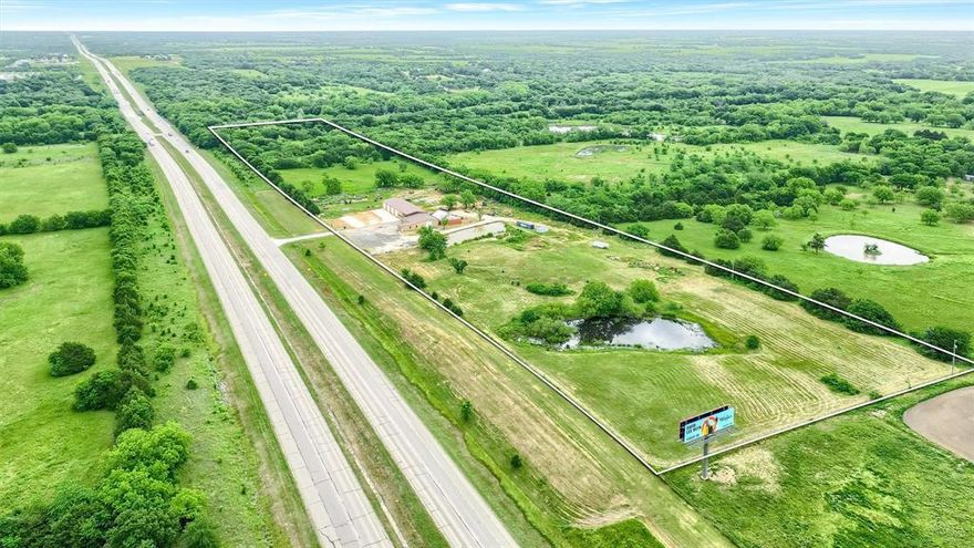 Unbeatable opportunity with just under 18 acres of Ag-exempt land featuring extensive frontage on Hwy 82 in Sadler, Texas. This property includes a newly constructed commercial building with a pier slab foundation, ideal for a wide range of business uses. The building features multiple office spaces including kitchen, dining area, and extra garage ready for immediate occupancy. Enjoy the scenic beauty of a gorgeous pond, adding both charm and potential for additional recreational or aesthetic value. Located in an incredible central location, this property is just minutes from Sherman, TX, offering convenience without sacrificing  space or privacy. Whether you're looking to launch a business, expand your operations, or explore development opportunities, this rare piece of real estate offers unlimited potential.