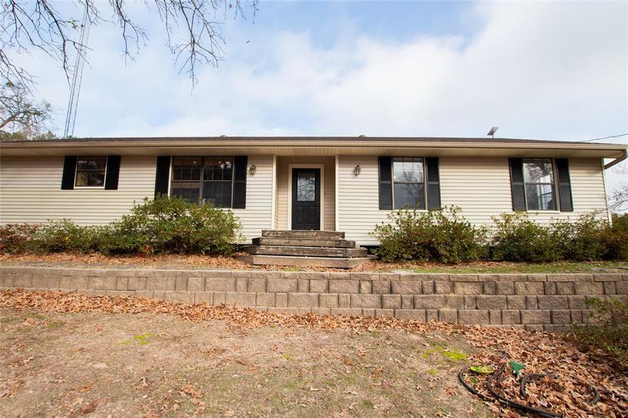 Tucked away on 8.624 peaceful acres just outside the city of Tyler, this charming 2-bedroom, 2-bathroom home with a 2-car garage offers 1,688 square feet of rustic comfort and modern convenience. Enjoy the privacy of country living while remaining just a short drive from all the shopping, dining, and amenities Tyler has to offer.

Inside, the home features a warm and inviting open layout with beautiful hardwood and tile flooring throughout. The remodeled kitchen is both spacious and functional, offering ample counter space and storage while seamlessly connecting to the living areas—perfect for everyday living or entertaining. Large windows throughout the home fill the space with natural light and showcase peaceful views of the surrounding acreage.

The living area is cozy and welcoming, highlighted by a wood-burning stove that adds character and warmth. Both bedrooms and bathrooms are generously sized, well-lit, and designed for comfort. A versatile bonus room provides additional space for a home office, hobby room, or guest area.

Outside, the property is 100% fenced and cross-fenced, featuring improved pastures ideal for horses and other livestock. Additional highlights include a loafing shed and plenty of open land for animals, gardening, or outdoor enjoyment. With a fairly new roof, thoughtful updates, and a tranquil setting, this property offers the perfect balance of rustic charm, space, and convenience.

Experience the best of country living without sacrificing access to the city—this one is truly a rare find.