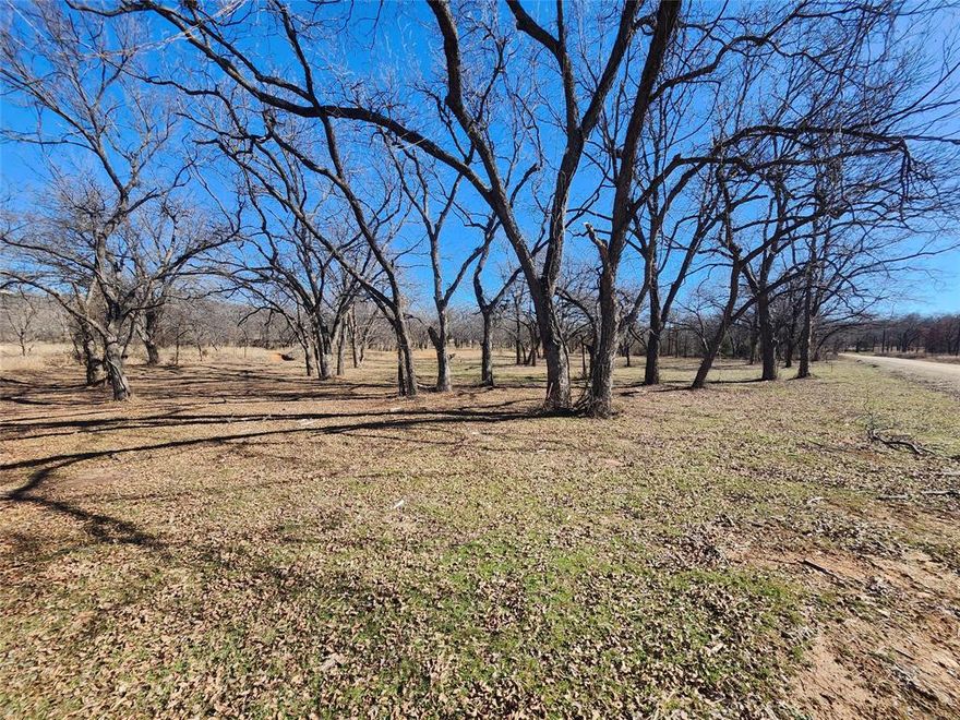 Just under an acre building site lot with mature oak trees  to build your future home. This lot backs up to Barefoot creek. Lots are surrounded by the tranquility of nature as you will often see deer all around the property. Nocona Hills offers a 24-hour guarded gated community with access to two private lakes (one listed as top 5 Bass fishing in Texas)a community boat ramp and dock, as well as an 18-hole golf course with driving range, an airstrip, campgrounds with RV sites, and more. Utilities include co-op water and electric already at street. Fiber optic high speed internet is also available. Nearby surroundings include historic downtown Nocona, a winery, brewery and just a short drive to Saint Jo, Muenster and popular Casinos. Come see this gem. 
Owner has multiple lots available to choose from, please contact listing agent for details.  The Club house is under remodel along with the pool such an exciting new Update for the community.