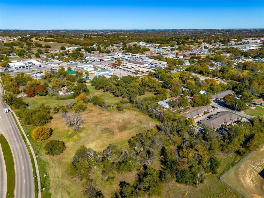 Zoned Commercial C1 PRIME LOCATION with 200 ft Road Frontage. Annual Average Daily Traffic counts of over 16,000! Because we all know location is king for a business' success, you will clearly see this is a great location for a future business site. The lot begins North of the Jack Borden Way Bridge and is positioned perfectly between Fort Worth Highway AND Santa Fe Dr - & because of this great location your business would receive easier access & simply more traffic from both thoroughfares on either side! The Weatherford Heritage Park is less than 1000ft away - where regular events are hosted such as Movie Night, Musical Concerts & First Mondays each Month - what that means for you is that you will benefit from all that extra traffic & exposure for your business when you are located in this perfect spot! Heritage Playground & Dog Park are basically next door! As you can see, so many opportunities that you will gain from being in such a great location.