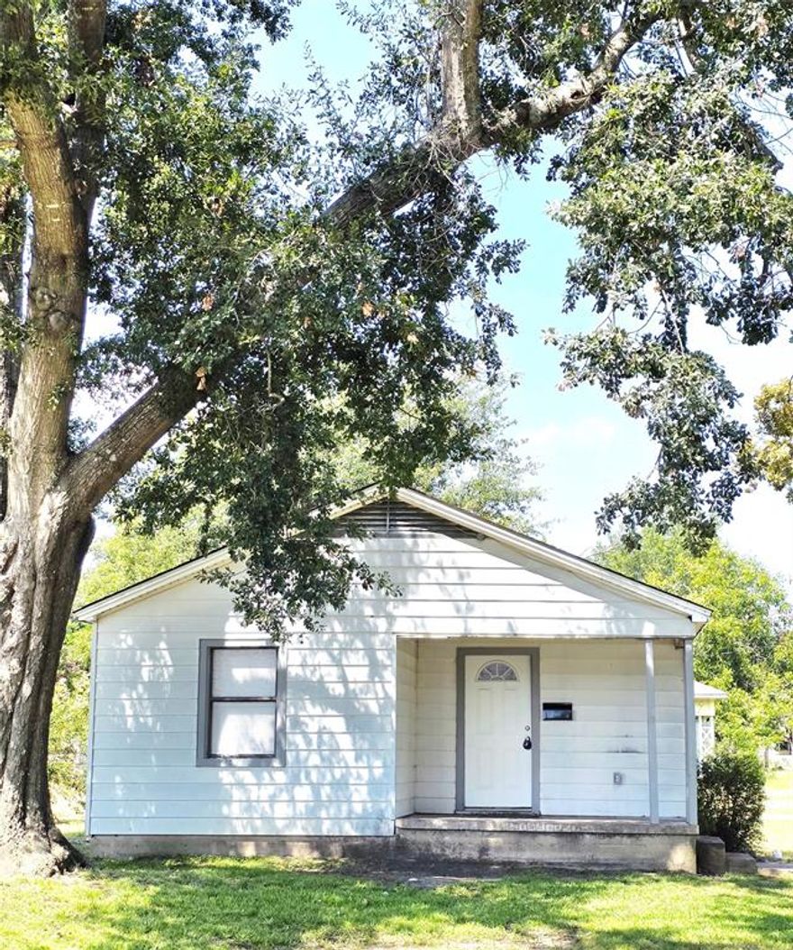 **New Price** on this Cute Terrell 3 bedroom home in a fantastic historic neighborhood and located on a **.33 acre lot**. Walking distance to **Ben Gill Park**. Updated appliances, updated bathroom, windows galore make this home light and bright and open to the greenery of the tree lined lot. **Open Floorplan** living room, dining and kitchen. **Extra Long One Car Garage** with the washer-dryer hock ups could accommodate a workshop area, a man cave, and your car! This large lot would be perfect for expanding this home to a much larger one, or building your own historic home, even room for adding a pool and outdoor living area. **The Possibilities are Unlimited**