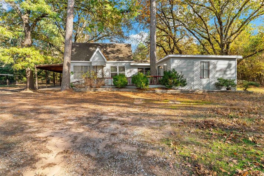 Stones throw from Pat Mayes Lake!  If you are looking for serenity in the wood, this is it!!   This gorgeous wooded acreage is located almost to Corp of Engineers property at Pat Mayse Lake so you may never have neighbors on these 13+ acres! This property features a pole barn, 12 X 15 building and large tin barn for all of your storage needs. This 4 bedroom, 2 bath home is ready to update or remodel to your heart's content!  The farmhouse style home is ready to create a weekend cabin or to make your permanent home! Don't miss out on this opportunity!