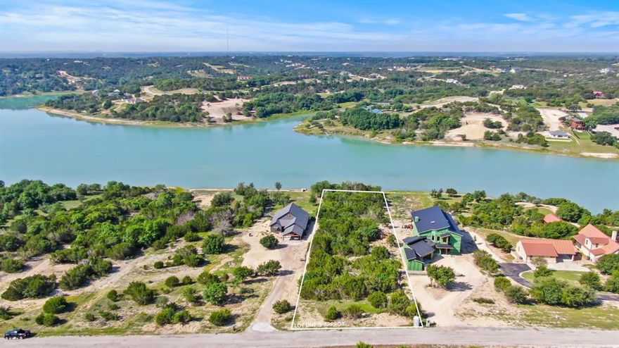 Welcome to 1840 Lakeside Dr in Bluff Dale, Texas.  Nestled within the prestigious Mountain Lakes community, this magnificent 1.270-acre waterfront vacant lot promises a picturesque setting for your dream home. With its captivating natural beauty, serene surroundings, and exclusive amenities, this property offers a truly idyllic lifestyle. Imagine waking up to breathtaking sunrises and ending your days with tranquil sunsets over the water. Whether you are an outdoor enthusiast or simply seeking a peaceful retreat, this location provides the perfect backdrop for a life of relaxation and recreation. Boasting 150 feet of prime waterfront access, spend your days fishing, kayaking, or taking a leisurely boat ride on the calm waters of the lake. The Mountain Lakes community offers an array of exclusive amenities designed to enhance your lifestyle.  Residents enjoy access to two pristine lakes, a community pool, clubhouse, park areas, and picnic spots, all within easy reach.