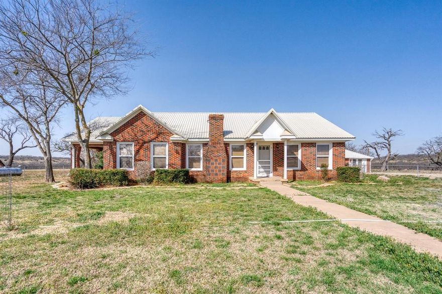 This stunning 930-acre property offers a perfect blend of natural beauty and functionality. Featuring rolling hills with 50-60 feet of elevation changes, the land provides incredible scenic views and diverse terrain. The property is equipped with 6 well-stocked tanks with catfish, crappie, and largemouth bass, offering excellent fishing opportunities. A seasonal creek runs through the land, attracting abundant wildlife for hunting, including deer, dove, and turkey. The property is easily accessible with a well-maintained road system. A charming 3-bedroom, 1-bath brick house offers a comfortable living space, complemented by a separate brick building with a bunk room for guests or extra storage. There is also a large metal equipment barn for all your storage needs and working pens for livestock. Don’t miss the opportunity to own this remarkable piece of property!