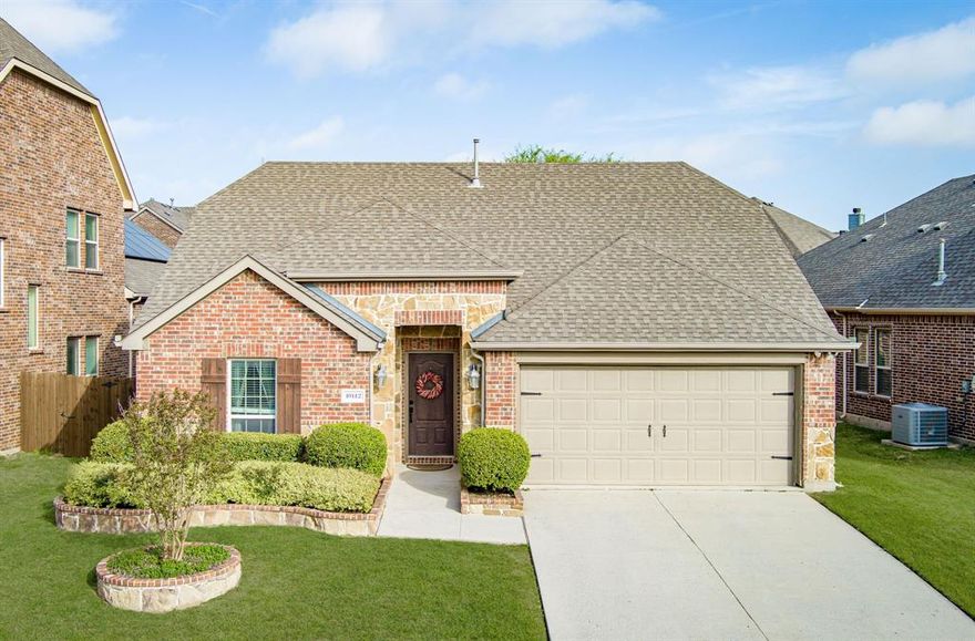 Beautiful single-story home in the highly desirable Reserve at Westridge, zoned to Prosper ISD and conveniently within walking distance to the elementary school. This thoughtfully designed open-concept floor plan is ideal for both everyday living and effortless entertaining. The kitchen showcases granite countertops, a spacious breakfast bar, and a gas cooktop, all flowing seamlessly into the dining area and inviting family room. The family room is anchored by a beautiful cast stone gas fireplace, creating a warm and welcoming focal point. The split primary suite offers privacy from the secondary bedrooms and features an ensuite bath with dual sinks, a relaxing jetted tub, separate shower, and generous walk-in closet. A versatile fourth bedrooms with French doors provides the perfect space for a home office, study, or flex room. Step outside to the covered back porch overlooking a private backyard with a wood privacy fence, perfectly suited for outdoor gatherings and quiet evenings alike. Residents enjoy access to exceptional community amenities, including a clubhouse, resort-style pool, playground, park, and scenic walking trails, all within this established and well-maintained neighborhood.