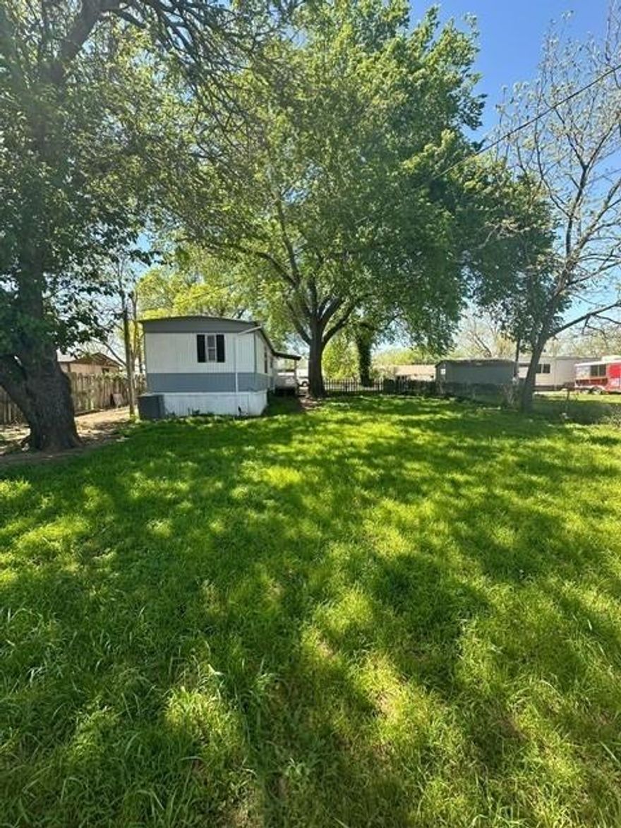 Mobile home that needs a full remodel located on a nice-size residential lot with mature trees shading the property. Easy access to 174 for commuting.