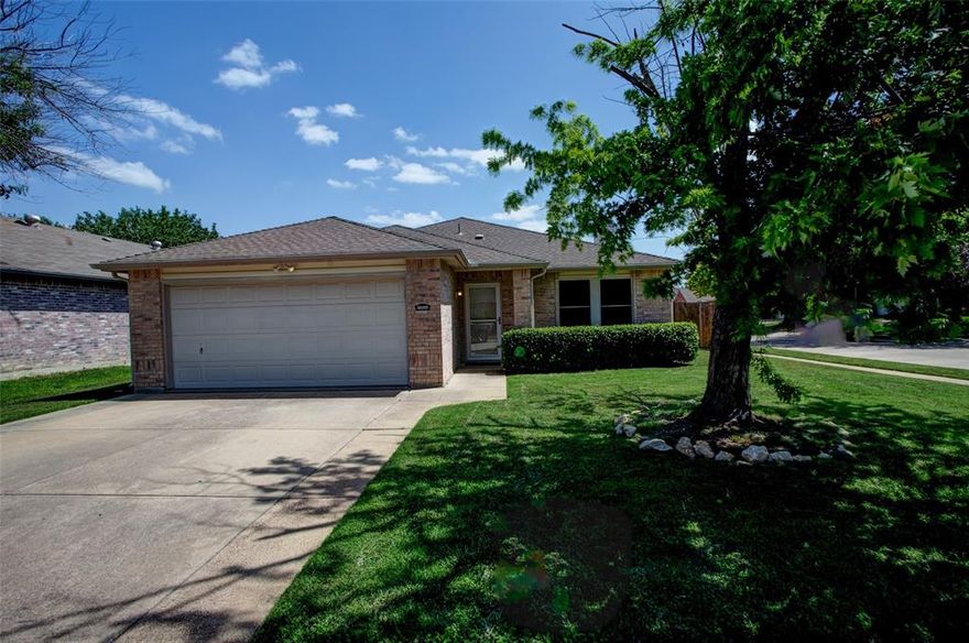 Charming 3-Bedroom Home on Corner Lot with Solar Savings!

This beautifully updated 3-bedroom, 2-bath home offers 1,829 sq. ft.  of comfortable living on a spacious corner lot. The home has been freshly painted and is truly move-in ready, offering a warm and inviting atmosphere from the moment you step inside. The open floor plan features one large living area with a cozy wood-burning fireplace and two dining spaces—perfect for both everyday living and entertaining.  Engineered wood and ceramic tile flooring throughout provide durability and low-maintenance living, with no carpet anywhere. The private backyard includes a large, powered storage building, ideal for a workshop or extra storage. Solar panels will be paid off at closing and convey to the buyer, offering long-term savings on electric bills. Highlights include: Primary suite with a large walk-in shower, double vanities, and walk-in closet.  Bright kitchen with a cozy breakfast area and large walk-pantry.  Spacious, open layout with excellent natural light.  Storage building in backyard is wired with electricity.  Garage is insulated including doors and has HVAC system.  Neighborhood amenities include parks, sports courts, and a community pool just a short walk away. Conveniently located near schools, shopping centers, and Loop 820, with an elementary school within walking distance. This home offers the perfect combination of comfort, energy efficiency, and location.