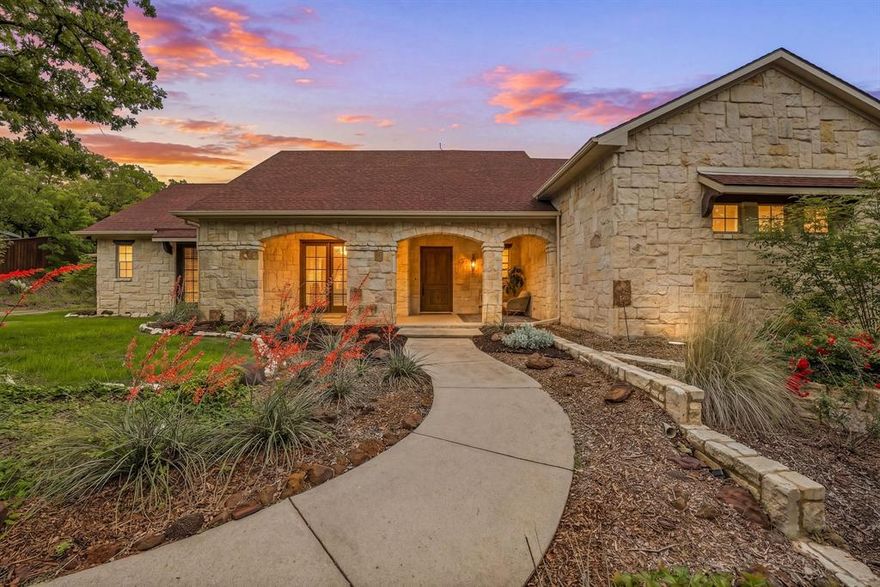 Hidden at the back of a quiet culdesac in sought-after Butterfield Junction, this custom stone home delivers a rare combination of privacy, nature and modern comfort on approximately 2.2 heavily wooded acres with serene creek and woodland views. Thoughtfully updated throughout, the open, inviting floor plan offers approximately 3,878 square feet with light-filled living and dining spaces that capture the views, plus a beautifully finished media and game room loft above the oversized garage with skylights, built-ins and beverage fridge. Outdoor living shines with a covered front porch, expansive rear covered patio, resort style pool and spa with recently refreshed decking and finishes, and private hiking trails that wind through the trees to the Ray Roberts Lake Isle du Bois park trail system for hiking, biking and horses or dogs. Recent improvements include interior and exterior paint, updated bedroom flooring, remodeled front bath, two tankless water heaters, whole-house and under-sink water filtration with UV treatment, and a modern 50amp solar panel system with backup battery for efficiency and peace of mind. Solar panel system is owned. Set in one of Pilot Point’s most desirable wooded communities just minutes from Lake Ray Roberts and North Texas Horse Country, this property lives like a private retreat while still being convenient to Denton, Sanger and the 380 and 35 corridors.
