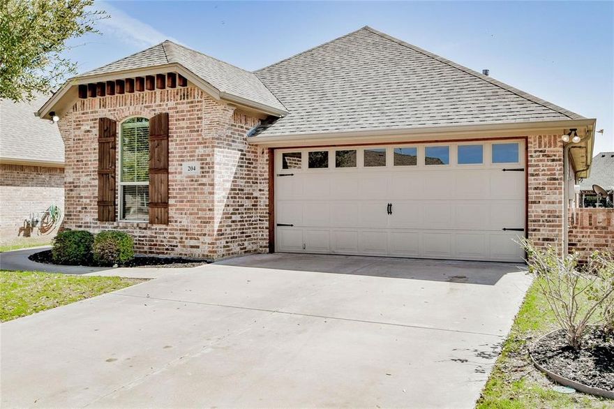 Exquisite 3-bedroom, 2-bath lakeside home located in the highly sought-after, gated community of Abe’s Landing. Built by Chris Thomas Homes, this thoughtfully designed home blends comfort, functionality, and style.
Inside, you’ll find easy-to-maintain tile flooring, a cozy fireplace, and a beautifully appointed kitchen featuring granite countertops, a large island, stainless steel appliances, and custom wood cabinetry. Kitchen Refrigerator and LG washer and dryer both convey! Additional upgrades such as a water softener and ADT security system add convenience and peace of mind.
The spacious primary suite is designed with accessibility in mind, offering 42-inch wide doorways, a large ensuite bath with a walk-in jetted tub, and an oversized walk-in closet.
Step outside to a generously sized backyard—perfect for relaxing or entertaining.
Residents of Abe’s Landing enjoy community amenities including a pool, playground, and gated entry with security cameras. Ideally located just minutes from Lake Granbury, Hunter Park, shopping, and H-E-B.
Experience the perfect blend of peaceful lakeside living and everyday convenience—this one is worth seeing.