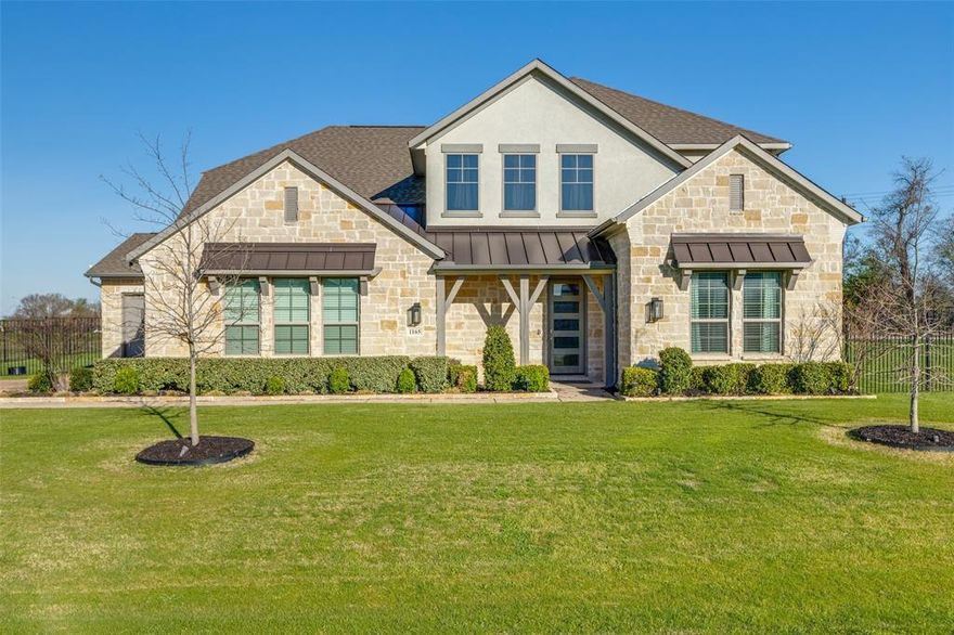 Stunning floor plan featuring modern finishes and an open-concept design perfect for both everyday living and entertaining. Expansive sliding glass doors fill the home with natural light and open to a large backyard on a 1-acre corner homesite. The main level offers a luxurious primary suite along with a private guest suite with full bath. Also on the first floor are a private study and formal dining area. The chef-inspired kitchen boasts abundant countertop space, a large walk-in pantry, and a seamless flow into the living areas. The spacious primary retreat features a contemporary freestanding tub, mudset walk-in shower, and dual walk-in closets with direct access to the laundry room for ultimate convenience. Upstairs includes three generously sized bedrooms, two additional full baths, and a large game room, providing plenty of space for family and guests. Located near the shores of Lavon Lake, this home provides a perfect blend of country seclusion with close proximity to greater DFW.