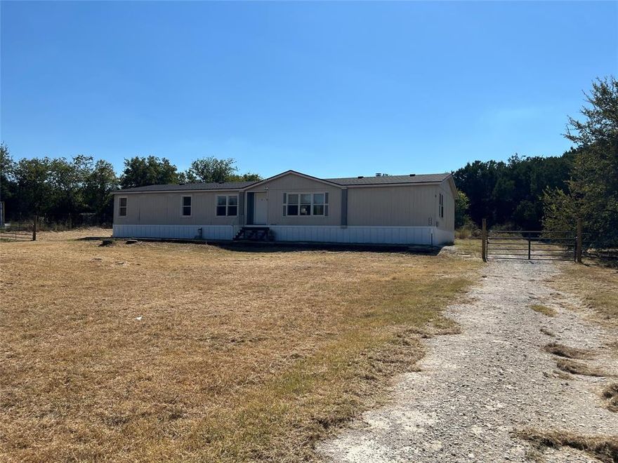 Welcome to your newly updated and spacious home on a tranquil 1-acre lot, just minutes from Lake Granbury! Everything in the home has been redone and lives likes its branch new with new roof, HVAC and ducts, carpet, paint, newly polished and stained cabinets, new porch steps, gate and wire fencing. This home boasts over 2000 sq ft and features a split bedroom set up with three beds and two baths on one side of the living-kitchen-dining areas and the primary ensuite on the other side. The home is open and light filled with generous bedrooms and large closet spaces allowing for plenty of storage. Outside, the expansive 1-acre lot offers plenty of room for outdoor activities. Located on the north side of Granbury, perfect for easy travel north and just 10 minutes from town with abundant shopping and restaurants, the home is also just a short 10-minute drive to Lake Granbury. This property combines peaceful country living with easy access to shopping and recreational amenities.