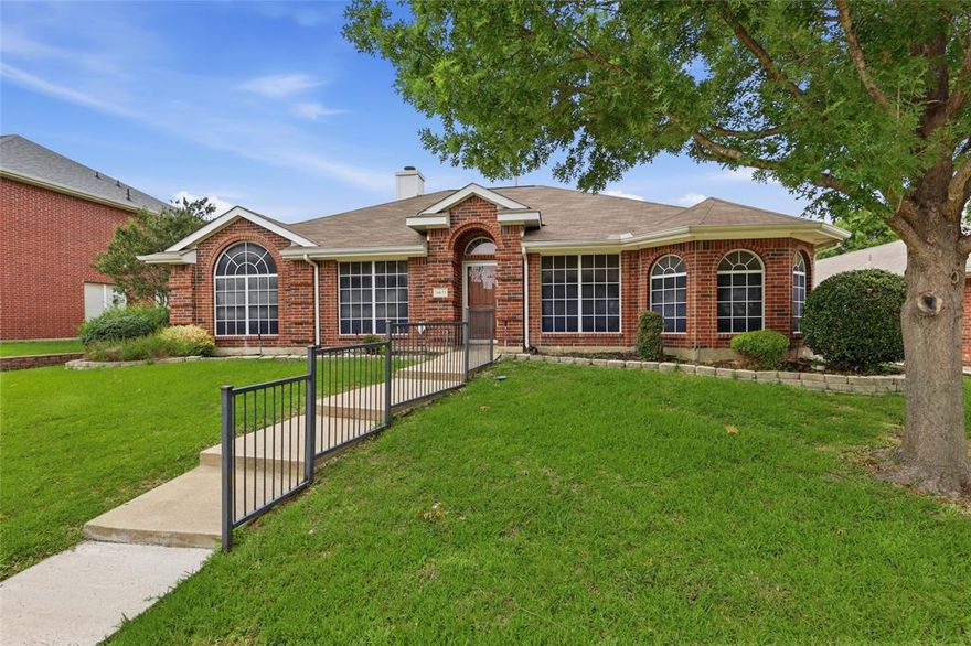 Charming single-story home featuring 3 bedrooms and 2 baths with a flexible floorplan and inviting living spaces. The front living and dining area offers great versatility, while the open family room, kitchen, and breakfast area create the perfect space for everyday living and entertaining. Family room features a cozy fireplace and overlooks the spacious enclosed back porch, providing additional space to relax year-round. Split bedroom layout includes two secondary bedrooms and bath toward the front of the home, with the private primary suite tucked away off the family room. Large laundry area and rear-entry garage add convenience. Cute backyard with easy access to shopping, restaurants, and major commuting routes.