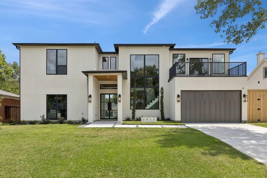 Step into a residence where thoughtful architecture and refined craftsmanship meet in the heart of Dallas’ most desirable pocket. Designed to impress from every angle, this newly constructed 4,501 SF home offers a seamless blend of California clean lines and transitional elegance. Inside, 5 spacious bedrooms and 5 bathrooms unfold across two levels, with volume ceilings, an open-concept living and dining layout, and natural light pouring in through floor-to-ceiling picture windows. The heart of the home a designer kitchen with a massive 9’ island—flows effortlessly into the living room and rear porch, creating the perfect indoor outdoor vibe. Expect more than builder-basic: custom millwork, vaulted ceilings, statement staircase, and architectural window placements that elevate every corner. The primary suite is tucked away downstairs for privacy, with spa-like bath and dual vanities. Upstairs features a game room, jack-and-jill setups, and bridge-style hallways that overlook the dramatic great room.