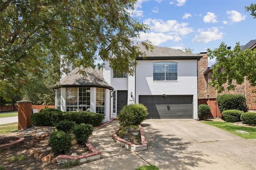 Beautiful and spacious, this two-story home in Valley Ranch is move-in ready and filled with on-trend updates throughout. Sitting on a corner lot with a backyard paradise, it offers serene views of lush greens and a peaceful creek. Upon entry, you’re welcomed by abundant natural light and a versatile bonus room with double French doors, custom built-ins, ceiling fan, and fireplace—perfect as a study or second living space. The stylish kitchen showcases sleek wood-slat detailing on the island, a modern black undermount sink, stainless steel appliances including a gas range, and a pantry. The kitchen flows seamlessly into the sunlit dining room and open living area, where walls of windows frame the backyard oasis. Step outside to an expansive patio shaded by mature trees—an ideal retreat for entertaining or simply unwinding with nature. Upstairs, the private primary suite offers a tranquil escape with a feature accent wall and a charming sitting area that could serve as an office or reading nook. The spa-inspired ensuite bath boasts dual vanities, a soaking tub, separate shower, and a huge walk-in closet. Combining comfort, style, and natural beauty, this home is a true gem in Valley Ranch.