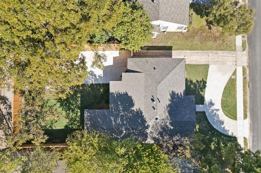 Rare two driveway home. Plenty of parking for you and your visitors. 

Timeless charm meets modern peace of mind, this fully renovated home in the Mockingbird Elementary zone offers thoughtful design, quality craftsmanship, and a prime location near White Rock Lake and the highly regarded Spanish World School.

Inside, original hardwood floors, beautifully preserved and freshly refinished, glow with natural light throughout the open concept layout. The spacious living and dining areas flow seamlessly into the kitchen featuring quartz countertops, custom cabinetry, premium appliances, and a smart layout perfect for daily living or entertaining.

The private primary suite is a true retreat, with vaulted ceilings, double closets including a cedar lined option, and a luxurious ensuite bath that feels like a personal spa. Every detail in this home supports comfort, style, and ease of living.

Step outside to a beautifully landscaped backyard with new sod, garden beds, and a full privacy fence. An outdoor kitchen makes entertaining easy, while the circular drive, dual driveways, and rebuilt garage with modern doors and attic storage offer everyday convenience with standout curb appeal.

This home has been fully updated from top to bottom. Highlights include new Pella windows, complete electrical rewiring, new plumbing with no cast iron, a new sewer line to the alley, a top tier HVAC system, and a tankless water heater. Additional upgrades include solid core interior doors, custom blinds, contemporary lighting, fresh paint, decorative concrete, and an automatic gate.

For added peace of mind, the property has been professionally preinspected, with every item addressed by the seller for a truly move in ready experience. A partial termite pretreatment and a transferable Protex warranty offer long term confidence.

Perfectly located near parks, shopping, and dining, this home offers a rare combination of beauty, function, and location.