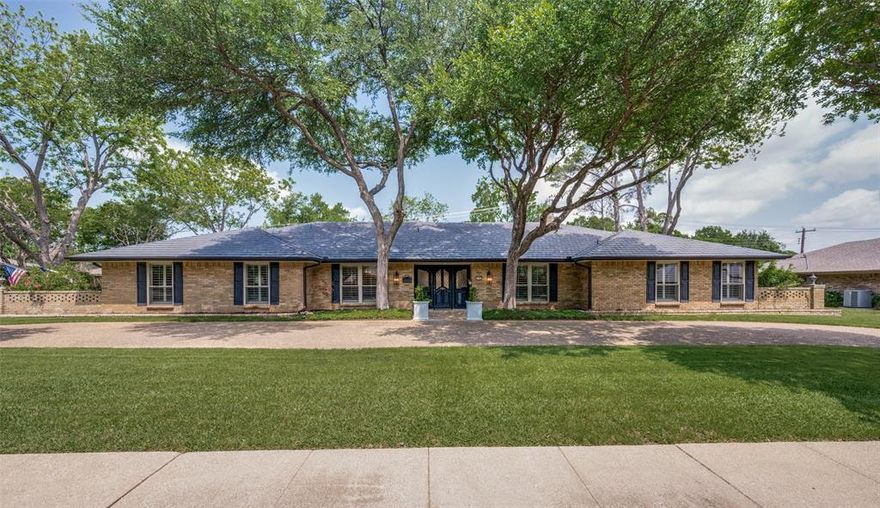 Step into this beautifully updated, sprawling single-story ranch nestled in the highly desirable Northaven community. From the moment you arrive mature trees, vibrant winter rye grass & timeless curb appeal set the tone for what awaits inside. The interior showcases extensive modern upgrades, including Calacatta Leon & white quartz countertops, Shaker-style cabinetry with european hinges, custom tile work, gorgeous wood flooring, tranquil paint selections & a wonderful floorplan where massive rooms & closets abound. The primary suite is a true retreat, featuring a freestanding soaking tub & frameless glass shower for a spa-like experience. There are his & her countertops & closets. An additional feature is direct pass through from master to additional bedroom. The expansive living area is filled with natural light highlighted by vaulted ceilings, a statement fireplace and seamless views of the backyard oasis. Step outside to your private retreat with covered patio offering year round shade, sparkling pool&spa with drilled holes for security fence, additional covered patio & large side yards all make for exceptional entertaining. The oversized 3 car garage offers room for multiple vehicles or work space & extra storage. Enjoy an unbeatable location just a short walk to Northaven Park & Withers Elementary along with easy access to the Northaven Trail offering miles of scenic paths for biking, jogging & walking among native Texas landscapes. The vibrant neighborhood hosts regular events such as BBQs, holiday celebrations & outdoor movie nights fostering a true sense of community. With nearby parks, top-tier recreational amenities & some of Dallas’ most beloved streets for seasonal festivities this home offers not just a place to live—but a lifestyle to love. Additional upgrades include an $80K steel roof, Energy-efficient windows, 1 HVAC system 2025, Pool Heater 2026, Pool Filter 2024, Pool replaster 2021, 3inch plantation shutters, Single car garge door & opener 2026.