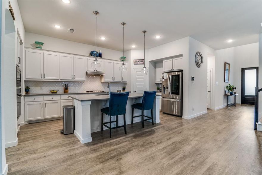 Welcome to this stunning 4-bedroom home in the desirable Devonshire community, offering comfort, style, and plenty of room to grow. From the moment you step inside, you’ll be greeted by soaring ceilings and an abundance of natural light streaming through expansive rear windows. The thoughtful layout includes a private guest suite with a full bath on the main level, perfect for visitors or extended stays.

The heart of the home is the open-concept living, dining, and kitchen area—ideal for everyday living and effortless entertaining. The kitchen boasts generous counter space, modern finishes, and a seamless flow to the oversized covered patio for outdoor gatherings.

Upstairs, discover a versatile layout with a spacious game room, a dedicated media room, an additional guest bedroom and bath, plus a full Mother-in-Law Suite complete with its own ensuite bath. Whether hosting guests, creating a home office, or enjoying movie nights, there’s space for it all.

This home blends elegance, functionality, and community living—schedule your showing today and experience the Devonshire lifestyle for yourself.