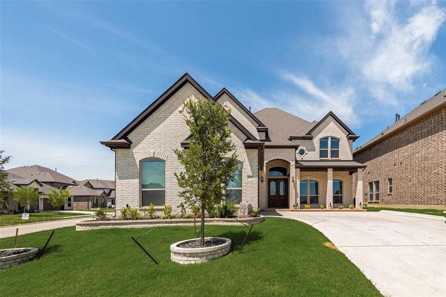 Seller offering $10,000 in concessions toward buyer’s closing costs with an acceptable offer. Constructed by First Texas Homes in 2022, this stunning residence boasts four spacious bedrooms and three and a half luxurious bathrooms. The home features an elegant curved staircase and a gourmet island kitchen, complete with a breakfast bar, double oven, custom cabinetry, and a decorative wood cabinet vent above the cooktop. The butler’s pantry is adorned with quartz countertops, adding a touch of sophistication. The master suite offers a spa-like experience with a bench seat in the shower and a garden-style soaking tub. The media room is perfect for entertainment, featuring a bar area and pre-wired surround sound that extends throughout the house. Upgraded flooring enhances the formal areas, entryway, and family room, providing a seamless flow and elegant ambiance. Situated on a corner lot, this property includes a two-car garage with epoxy floor and an 8-foot smart side wood garage door and showcases an upgraded elevation with beautiful brick accents. The sizable covered back patio is ideal for outdoor gatherings, and the central vacuum system adds convenience to daily living. This residence is a must-see and is ready for immediate occupancy.