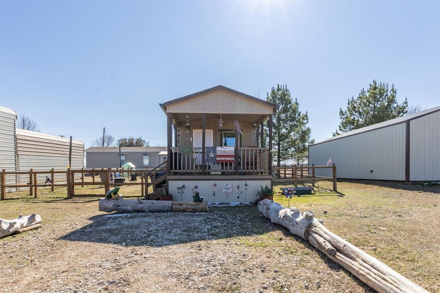 Holiday Village subdivision of Quitman offers a cozy 1 bedroom, 1 bathroom tiny home with an efficient layout and low maintenance living. The property features a fenced backyard, perfect for pets or private outdoor space. Located in Holiday Village with access to a private boat ramp on Lake Fork, clubhouse, and community pool. Ideal for weekend use, full time living, or investment potential.