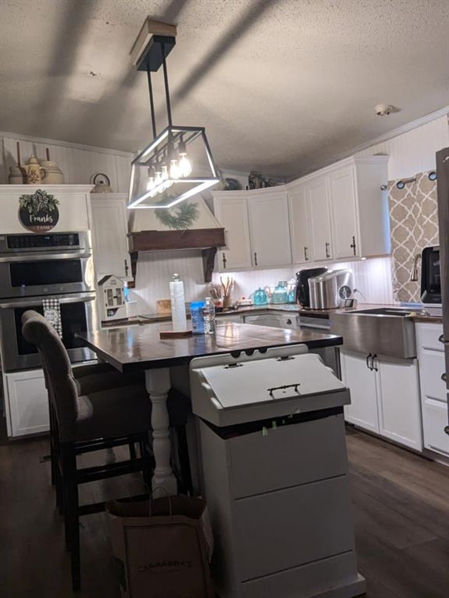 Discover the potential of this spacious 4-bedroom, 3-bath mobile home set on a full acre of peaceful land, offering plenty of room to grow and make it your own. With several updates already started, this property is perfect for buyers looking to add their personal touch and build equity with a little finishing work. Enjoy the privacy of country living along with exclusive access to a private boat launch—ideal for fishing, boating, and weekend adventures. Owner financing is available (some restrictions apply), and leasing options are also considered, giving you flexibility to choose what works best for your situation. Whether you're seeking a full-time residence or a quiet getaway, this property offers value, opportunity, and endless possibilities.