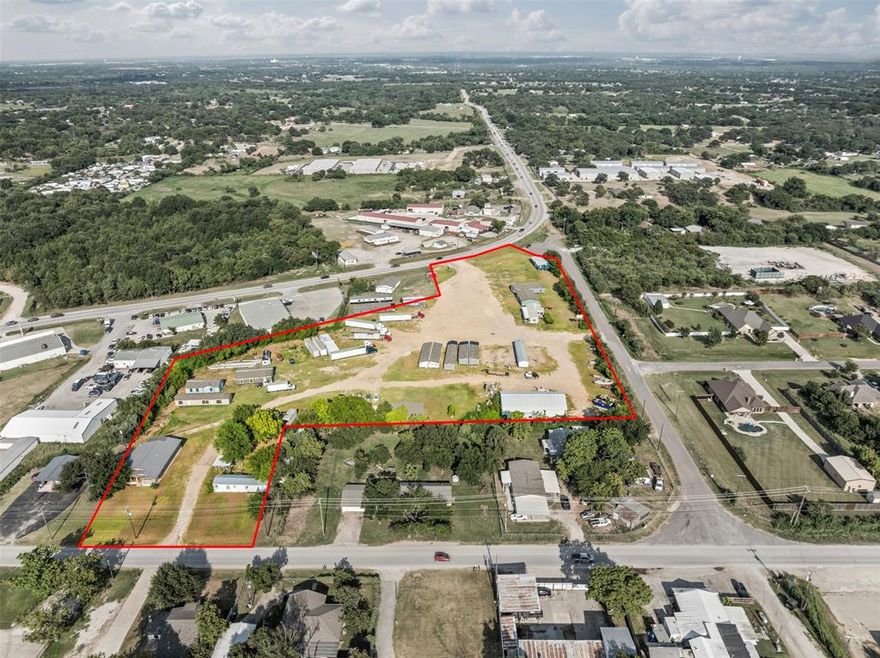 Unincorporated Tarrant county gem with just over 7 acres. Three entry-exit points along FM 1187, Rendon Road & Rendon Bloodworth making this a great option for a wide variety of uses. The final plans for the expansion of 1187 are not yet completed with the anticipated two options disclosed thus far not removing any part of this property. Near the intersection of Rendon Rd. and FM 1187, this highly visible property is a prime opportunity for multiple streams of income with the option to add advertising spaces or billboards, too. There is a 3,200 SF workshop on site with multiple water meters and electric meters already in place.  All mobiles will be removed prior to closing.