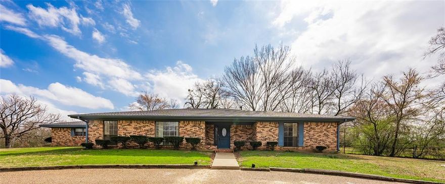 Situated on over a half acre, this home offers a spacious and versatile layout including sizeable bedrooms.    The two distinct living areas cater to both formal and casual gatherings, gas fireplace adds warmth and ambiance,  well designed kitchen with ample counterspace and breakfast nook, utility room with convenient half bath, large game room with bar area offers a unique entertaining space, large fenced backyard with covered patio makes this ideal for barbecues, relaxation, and outdoor activities.  New roof 2025. Malakoff ISD.