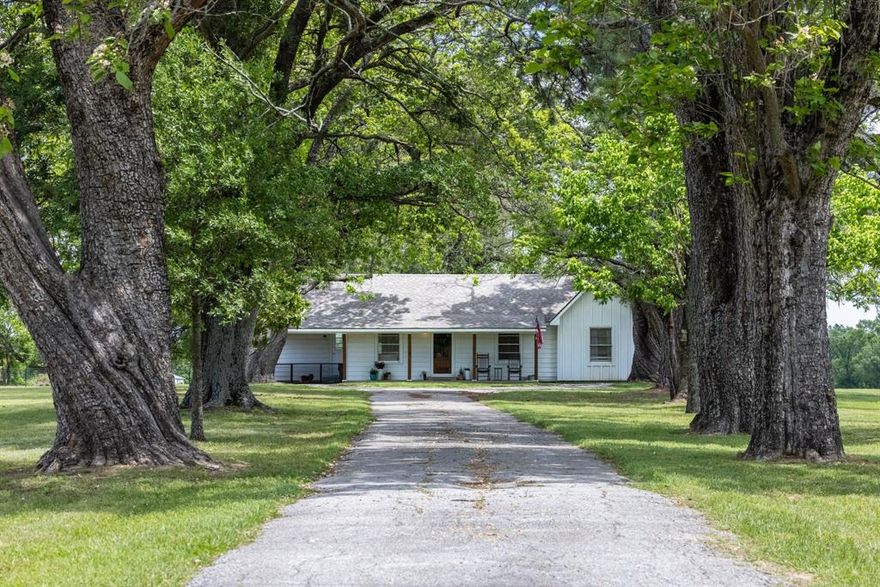 Welcome to the Davis Farm House—a rare blend of history, character, and modern comfort set on 5 picturesque acres. From the moment you enter the tree-lined driveway, you’ll understand this property is something special. Towering oak trees and a truly remarkable, oversized catalpa create a canopy that simply can’t be replicated—this is the kind of entrance that takes generations to grow, not something you can recreate overnight.

The completely remodeled and expanded home offers approximately 1,500 square feet of thoughtfully updated living space, featuring 3 bedrooms and 2 bathrooms. Every detail has been refreshed while preserving the charm and warmth you’d expect from a historic farmhouse. An attached 213 square foot carport adds convenience and functionality.

Beyond the home, the property is exceptionally well-equipped. A 300 square foot storage building with water opens the door for a private office, studio, or the perfect potting shed. The impressive 1,200 sqft- 30X40 shop, built in 2023, includes a 14x30 storage loft and a 12x40 covered patio—ideal for projects, entertaining, or expanding your workspace. 

Recent updates include a new roof installed in 2025 on both the main house and storage building,  HVAC replaced in 2023. 

Despite its peaceful, country setting, convenience is just minutes away—less than 5 minutes to Brookshire’s, Whataburger, Subway, and the post office, under 10 minutes to RISD schools, and only 10 minutes to the renowned Lake Fork.

The Davis Farm House isn’t just a property—it’s a legacy setting, where timeless beauty meets modern living. Opportunities like this don’t come along often.