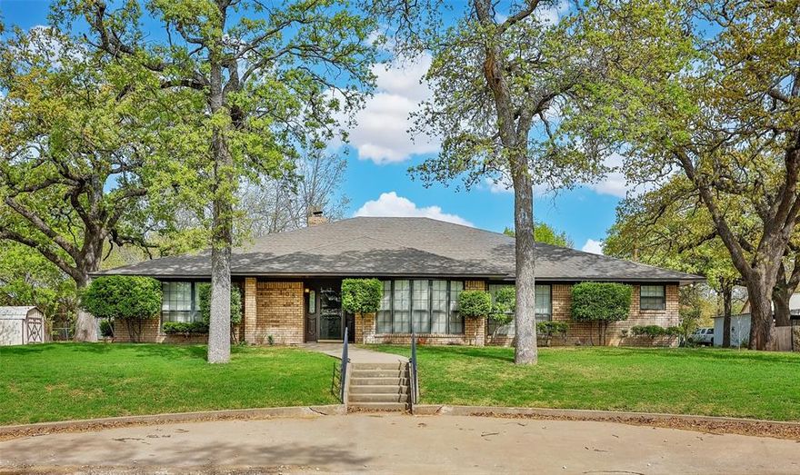 Welcome to refined living in the heart of Saint Jo! Perfectly positioned on a sprawling corner lot, this beautiful custom home offering the ideal blend of charm, comfort, and convenience..all within walking distance to historic downtown where you’ll enjoy local dining, unique boutiques, and vibrant entertainment. Step inside to a thoughtfully designed open floor plan featuring expansive floor plan, abundant natural light, and storage that truly sets this home apart. The inviting living area showcases a cozy fireplace with gas logs, and a dedicated office area, perfect for working from home or managing day-to-day life with ease. The chef’s kitchen is a true showstopper..complete with a large island, breakfast bar, custom cabinetry, and a pantry outfitted with slide-out shelving for maximum functionality. Whether you’re hosting or enjoying a quiet evening in, this space is built to impress. Spacious primary suite featuring an updated bathroom and generous closet space, large laundry room with sink and convenient half bath adds to the home’s practical layout. Throughout the home, you’ll find elevated touches like decorative ceilings and crown molding that enhance its custom feel. Recent updates—including the roof, water heater, and HVAC—offer peace of mind for years to come. Outside, the oversized corner lot is shaded by mature trees and features a circle drive, side-entry oversized garage, and an open patio perfect for relaxing or entertaining. This is more than a home…it’s a lifestyle opportunity in one of North Texas’ most charming small towns.