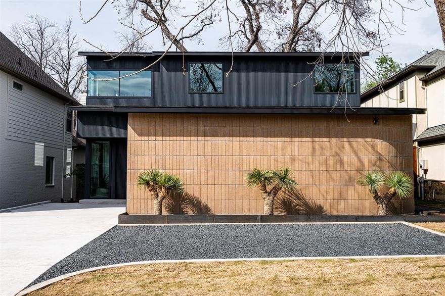 Stunning design from AIA award winning Architects Far+Dang, built by Thurmond Homes, is a modern masterpiece. The exterior is articulated with dark, vertical slats that create an intentional modern rhythm juxtaposed with a natural, earthtone vertical brick. The major wings of the house create an ‘outdoor room’ that celebrates the pecan tree and a secluded courtyard that elevates outdoor living. The great room with dining, living, and kitchen spaces have a direct view into the courtyard via expansive sliding glass doors and the other prominent space of the house, the primary bedroom. The primary suite features an extraordinary bath and walk in closet, vanity and utility room. All the upstair spaces surround this central outdoor haven taking advantage of the views and natural light that it provides. Special features unique to both the architecture and functionality of the home include multiple flex spaces designed to fit various functions such as a home gym, office, lounge or media room.