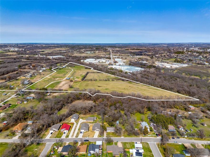 Centrally located in Weatherford, this exceptional 41.83-acre property is just 1.5 miles from the Town Square. The land offers approximately 2,800 feet of rail frontage and is fully fenced. Utilities include electric service, two wells, with City of Weatherford water and sewer available. The property is ag-exempt and can be zoned for both residential and commercial use, making it a highly versatile investment opportunity.