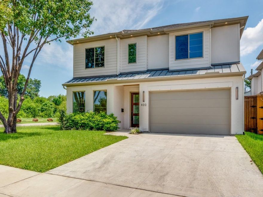 Discover the epitome of modern living at 400 Cristler Avenue, Dallas, TX—a stunning new construction by Blanchard Custom Homes, nestled on a fantastic corner lot along the scenic Santa Fe Trail. Surrounded by new development, this elegant home offers four bedrooms, three and a half bathrooms, and a versatile game room.

Step inside to find a thoughtful layout featuring a downstairs guest suite and a living room adorned with a cozy fireplace and custom built-ins. The gourmet eat-in kitchen is a culinary enthusiast's dream, boasting a large island, Electrolux side-by-side fridge-freezer, double ovens, a 5-burner gas cooktop, and a spacious pantry.

Upstairs, discover three additional bedrooms, including a Jack and Jill bath, a secondary game room, and a luxurious master suite. The master bath is a retreat in itself, offering a separate tub, a huge shower, dual sinks, and two separate closets for ample storage.

Embrace a lifestyle of comfort and sophistication at 400 Cristler Avenue—where every detail is designed for modern living.