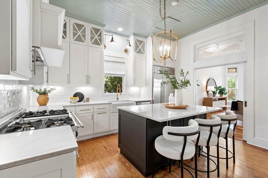 Don't miss the opportunity to own this beautifully restored 1887 farmhouse located in the heart of McKinney's historic district! This charming 4-bedroom, 3-bathroom residence sits on a generous half-acre lot with mature trees and a welcoming wrap-around front porch. Inside, the home features three living areas, an elegant dining room with fireplace, and a recently renovated chef's kitchen with custom cabinetry, spacious island, farm sink, Viking Tuscany range, and a Sub-Zero refrigerator. The master suite includes a freestanding tub, separate shower, dual vanities, and an expansive custom walk-in closet. All bathrooms have been completely renovated, and the bedrooms offer ample space. The large utility room provides plenty of storage with custom cabinets. The original hardwood floors have been professionally refinished throughout and you will find stained and etched glass in several areas of the home, reflecting the rich history of this 1887 home. The backyard is a private retreat with a screened-in back porch, hot tub, and endless opportunities on this spacious lot. Above the two-car garage, there's a finished flex room perfect for an office, den, or studio. With the proximity to Historic Downtown McKinney and the stunning features throughout, this farmhouse is truly unique and the perfect place to call home.