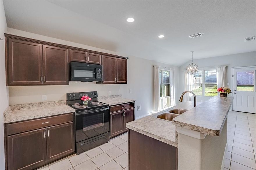 Beautiful, move in ready 7 year old single story home that's convenient to everything!  Tucked away in a quiet neighborhood just minutes from shopping, schools, parks and highways.  This gem is in pristine condition and features fresh paint and carpet.  You will love the floor plan as the kitchen is open to the living room and breakfast nook. The large den has 1 yr old luxury vinyl and ceiling fan.  The private, split primary bedroom overlooks the backyard and has a pretty in-suite bathroom with over-sized shower, dual shower heads, and large walk in closet. The home has custom-fit Trimlight programmable LED holiday lighting!  You will also find a lennox pure air whole home purifier with UV lights and 5-inch filter to greatly reduce allergens.  The attic has extra thick insulation to minimize the energy bill all year round.  The back yard is completely fenced and is just the right size with an extended patio and plenty of room for play and or pets. The sprinkler system is in both front and back yards.  Upgraded security system is also included! Room sizes are approximate.  This home is priced to sell! This location also qualifies for a lender 1.75% pricing incentive - call listing agent for mortgage company details.