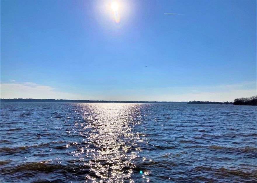 Beautiful Lakefront, gated community on Gorgeous Cross Lake in Shreveport. Lot is a little over an acre with spectacular views of open water on Cross Lake. Over 100 feet of water frontage. Enjoy Relaxing sunsets over the water every evening in this lovely established gated community. Very exclusive, less than thirty lots for entire subdivision. HOA annually covers common areas and community boat slips & security gate. Architectural requirements & building plans must be approved prior to beginning construction.  Note: these are temporary pictures of lot 15 that closed recently until my professional photographer can send me pictures of Lot 14 and will be changed out. The temp pictures also show Lot 14 since it is right beside lot 15.