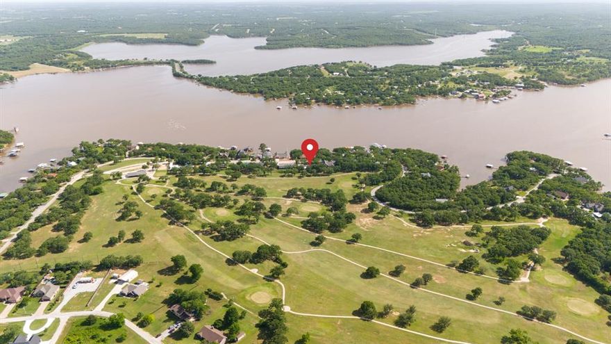 Positioned between the peaceful setting of Amon Carter Lake and the rolling greens of the Twisted Oaks golf course, this updated ranch-style home delivers a lifestyle of comfort, recreation, and space. With over 2,300 square feet, 3 bedrooms, 2 bathrooms, and two expansive living areas, this property checks the boxes for both function and leisure. Set on nearly a third of an acre, the home offers just the right balance of updates and character. The layout flows easily from one space to the next, with large windows that invite in natural light and frame scenic views of mature trees and the golf course just beyond the backyard. The primary suite is spacious and tucked away for privacy, while two additional bedrooms provide flexibility for guests, family, or a home office. Both living areas are oversized, offering plenty of room to gather, relax, or create a designated media or game space. Subtle updates throughout the home bring a refreshed feel while maintaining its original warmth and charm. Step outside and enjoy the best of North Texas living—just minutes from lake access for boating and fishing, and with golf course access practically at your back door. Whether you’re an outdoor enthusiast, a weekend entertainer, or simply looking for a little more breathing room, this home offers a rare blend of location and livability. Homes with this much square footage, direct golf course access, and proximity to Amon Carter Lake don’t come along often—come see why this one stands out.