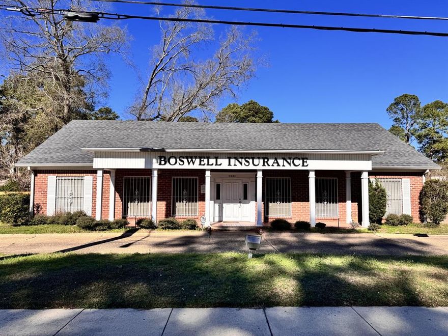 2,410 square foot office building for sale on heavily travelled East 70th Street with excellent exposure and visibility.  Centrally located in southeast Shreveport nestled in the heart of town, immediately east of Creswell Road.

Office building was built in 1980; however Boswell Insurance has owner-occupied since 1987, which has been a highly recognizable building with great curb appeal.

Office building contains an executive sized office, 4 private offices, large waiting room & reception area, workroom currently utilized for cubicles, kitchenette, men and women’s restrooms.

Two parking lots are located on the east and west sides of the building, with a circular drive accessible via East 70th Street for convenient access.  Zoned C-1.