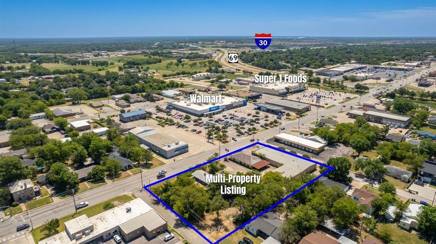Prime commercial opportunity! This multi-property offering spans an entire city block with 1.5 acres of combined land, strategically located on a high-traffic road directly across from a neighborhood Walmart with over 300 feet of frontage. Featuring 11,101 square feet of building space across 4 structures, this property presents unlimited potential. Whether you’re looking to renovate, restore, or completely redevelop, the options are endless. With its central location, this property is ideal for retail, office space, or mixed-use development. A build-to-suit project could transform the area into a bustling business hub, perfectly suited for modern needs. Take advantage of the excellent visibility and accessibility this property offers, and capitalize on the area's growth and traffic flow on Wesley Street.