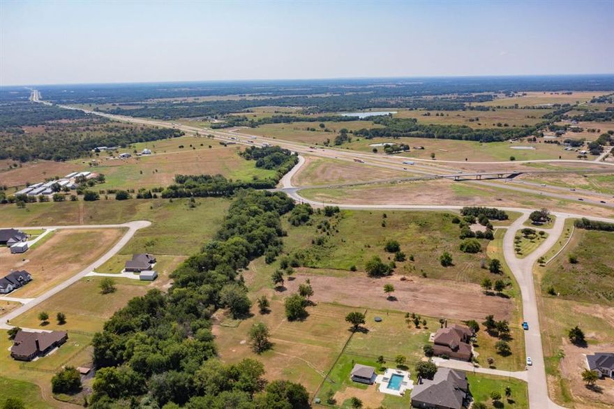 Location, Location, Location! This rare opportunity features two adjoining parcels totaling 20.600 acres in a prime, high-visibility location at the corner of I-20 and FM 2965. With excellent frontage and easy access, this property is perfectly positioned next to the desirable Shadow Lakes community in Wills Point—just approximately 45 miles east of the Dallas-Fort Worth Metroplex. Whether you're looking for a strategic investment, commercial development, or a private estate, this land offers outstanding potential in a rapidly growing area.