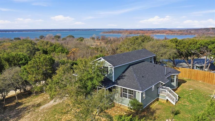 Owner financing available. Welcome to Paradise Point. This fully renovated 2,622 sq. ft. lake-view home offers  4 bedrooms and 3.5 bathrooms with a bright, luxurious open layout built for both comfortable living and entertaining.The upper level features a versatile space that works perfectly as a second living area or game room, positioned to capture stunning views of Lake Whitney. Major updates have already been completed, including two new HVAC systems, updated plumbing and electrical, a brand-new roof, and spray foam insulation in the attic, between levels, and beneath the lower floor for strong energy efficiency. Situated on nearly half an acre and directly across the street from Corps of Engineers land, this property offers convenient access to the outdoors while remaining just minutes from the lake. Whether you’re looking for a full-time residence, weekend escape, or investment opportunity, the flexibility is there.vIf you’ve been looking for space, views, and a move-in-ready home near one of Texas’ premier lakes, Paradise Point deserves a closer look.